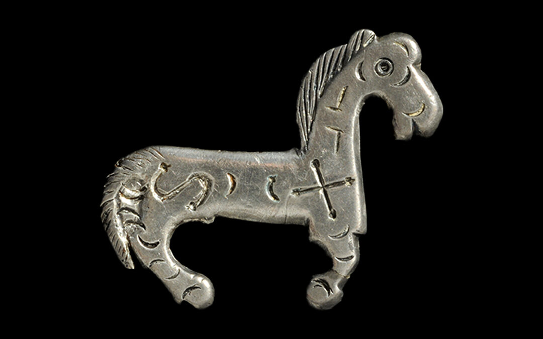 Silver fibula in the shape of a little horse