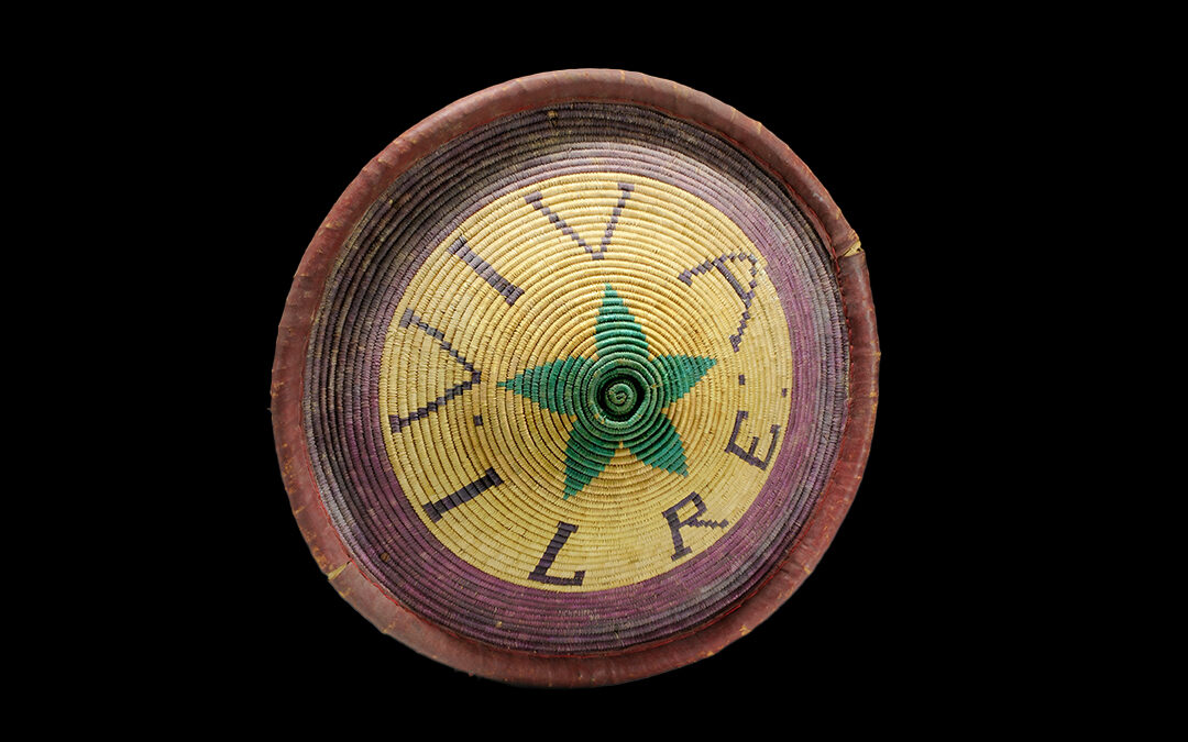 Polychrome fibre shield with “Long Live the King” inscription and leather-covered border