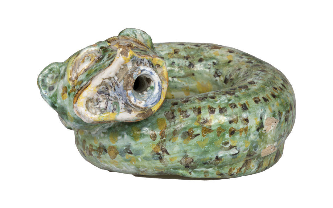 Green painted water bottle with black and yellow handles shaped like a coiled snake with a quadruped head